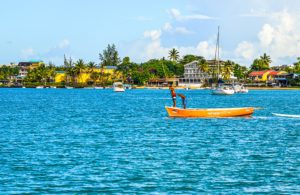 Local men rowing boat on sea in Grand Baie, Mauritius By Phuong D. Nguyen
