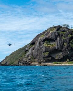 Helicopter Above Rugged Fijian Coastal Landscape, Photo by Mark Direen
