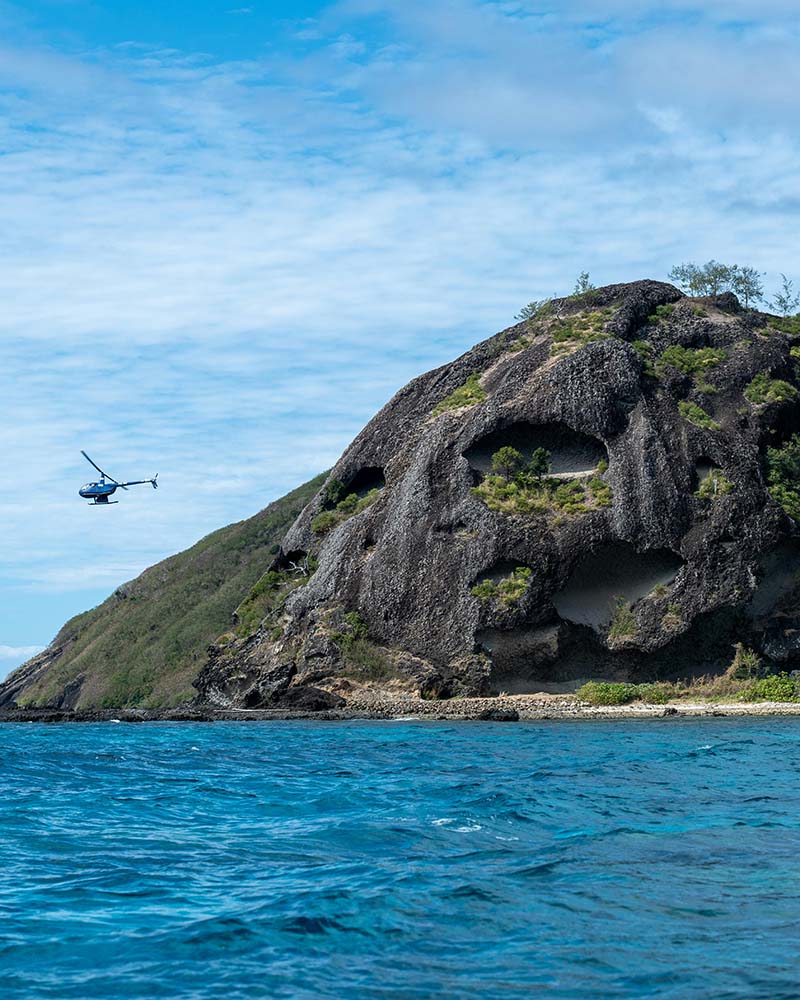 Helicopter Above Rugged Fijian Coastal Landscape, Photo by Mark Direen Helicopter Above Rugged Fijian Coastal Landscape, Photo by Mark Direen