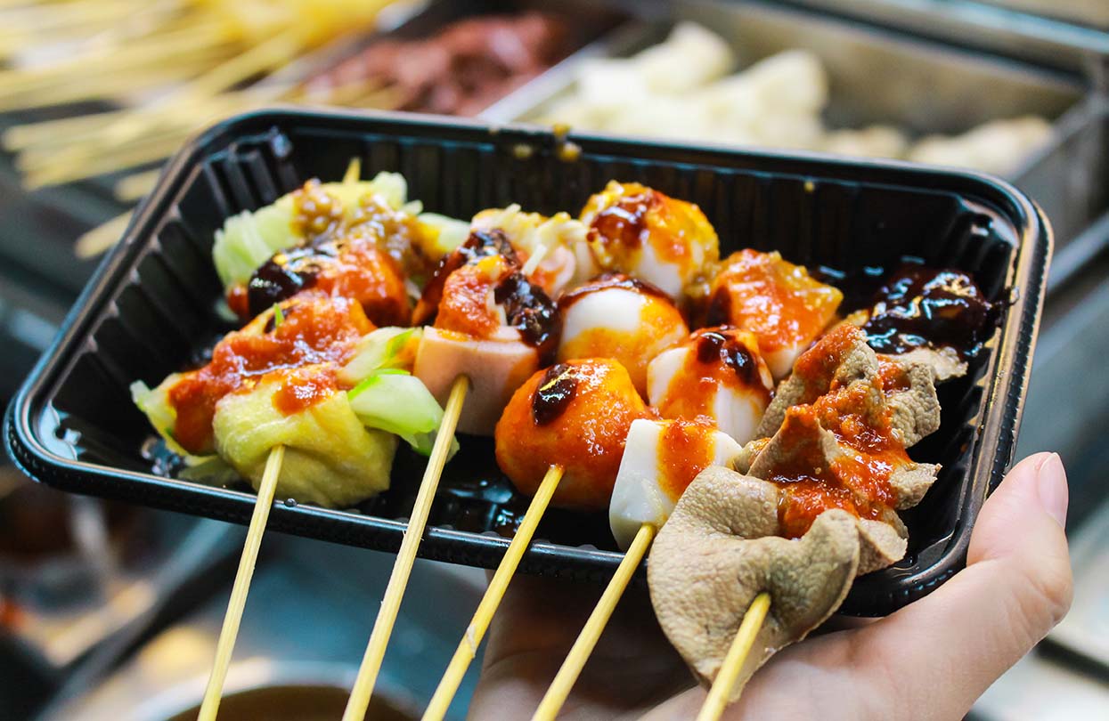 BBQ and Shabu-Shabu call Lok Lok, one of famous local outdoor dining in Penang, image by M Stocker, shutterstock